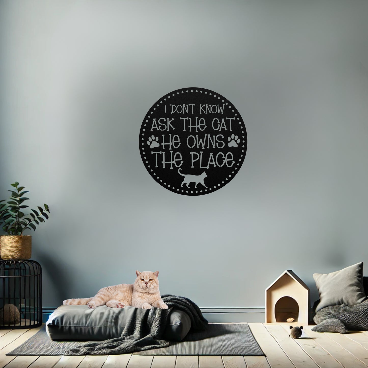 Circular Metal Sign that reads "I Don't know Ask the Cat, He Owns the Place"